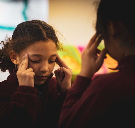 Girls thinking in a classroom